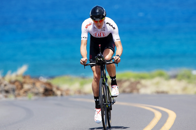 Triathlete Robin Schneider rides his Bike through Kailua, Hawaii
