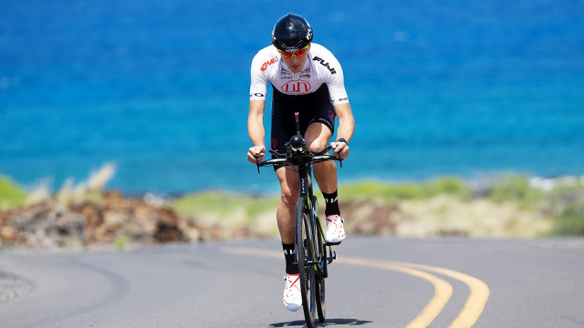 Triathlete Robin Schneider rides his Bike through Kailua, Hawaii