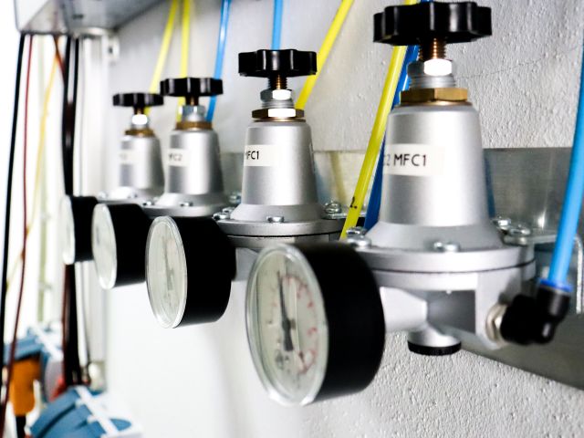 On the wall are gas installations.